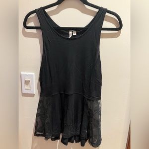Flowy black tank with lace detailing on sides